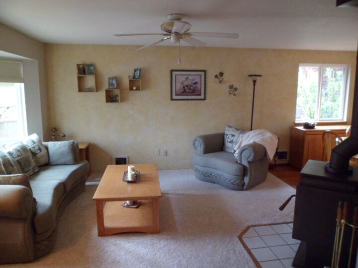 Property Photo: A. hard wood entry leads into formal living room w/ freestanding stove. 1122 103rd Dr SE WA 98258